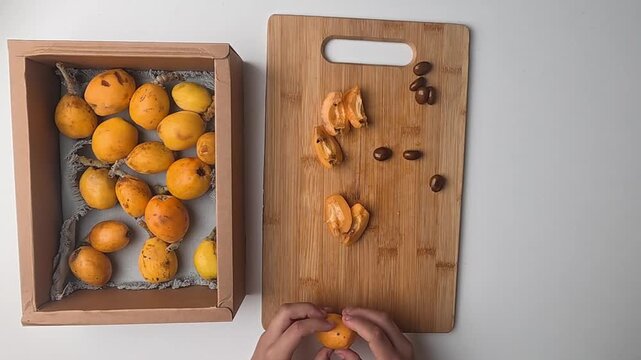 Hand holding loquats. Yellow fruit hand. medlar in hand, close-up. High quality photo