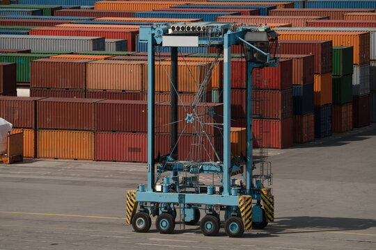 Container straddle carrier in shipping port yard
