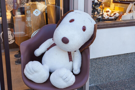Kyoto, Japan - April 21, 2026: Large Snoopy character plush sits outside of a Snoopy themed cafe in Japan