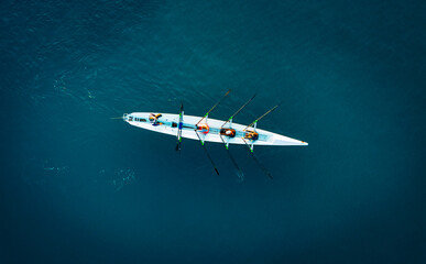 Aerial View of Rowing Team on Deep Blue Water © cn.ycl