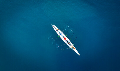 Aerial View of Rowing Team on Deep Blue Water © cn.ycl