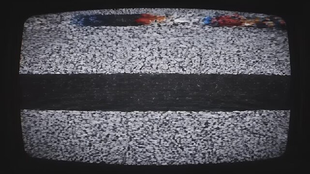 A close-up view of a vintage television screen displaying static, evoking a sense of nostalgia and technological obsolescence.