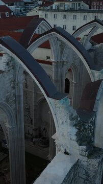 Cinematic Aerial View of Ancient Gothic Church in Lisbon Portugal at Golden Hour