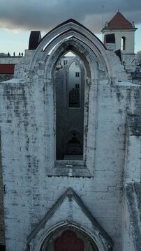Cinematic Aerial View of Ancient Gothic Church in Lisbon Portugal at Golden Hour