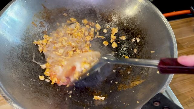 Closeup of Making Pad Thai with Shrimp in a Wok