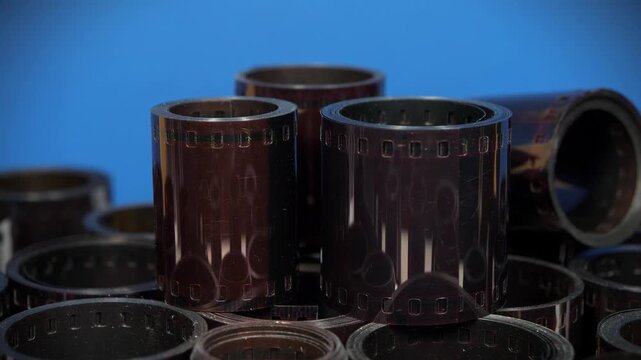 Old photographic films. Old camera film for retro photo shoots. Vintage film rolls for classic photography. Developed retro film rolls from analog cameras