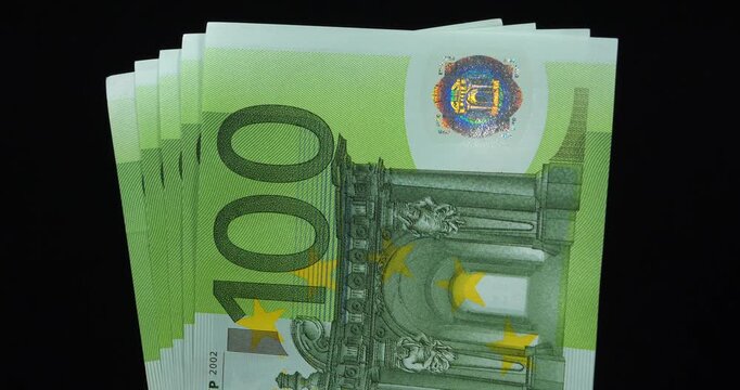 Euro banknotes. New green one hundred Euro banknotes. European Money. 500 Euros in five 100 euro banknotes 