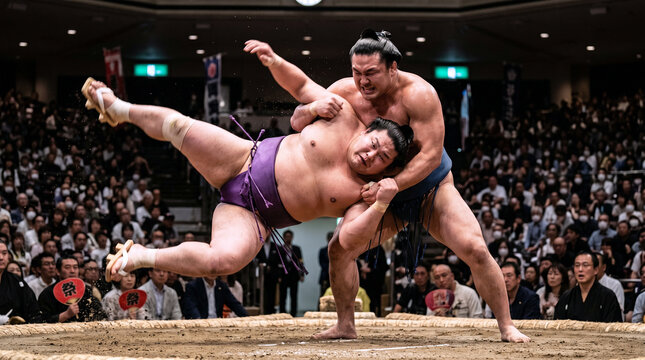 Two Sumo Wrestlers Competing in Arena Japan Tournament Crowd