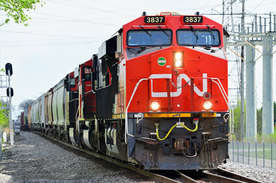 Canadian National Railway locomotives power a freight train norththbound through southwest suburban Chicago.