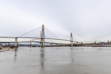 Cable-Stayed Bridge Over the Fraser River in New Westminster Vancouver BC Canada With Urban Waterfront Skyline © edb3_16
