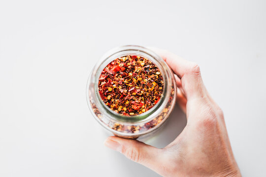 chilli flakes in glass pantry jar, top down close up