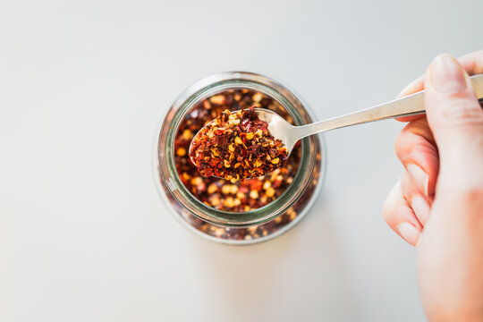chilli flakes in glass pantry jar, top down close up