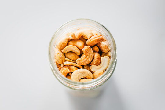 salted cashews in glass pantry jar; top down close up