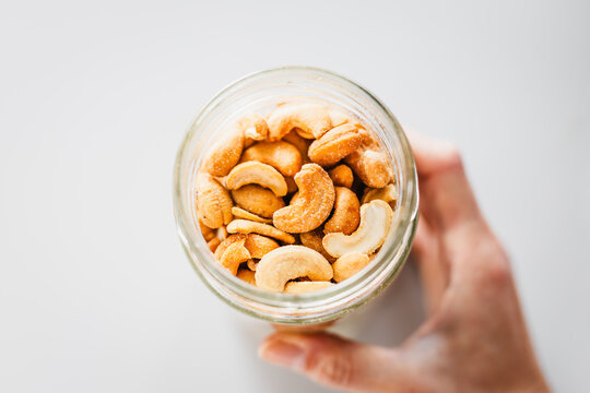 salted cashews in glass pantry jar; top down close up