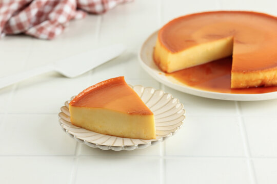Sliced Caramel Flan Quesillo on White Plate