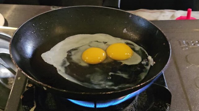 This is a sunny-side-up egg in a pan