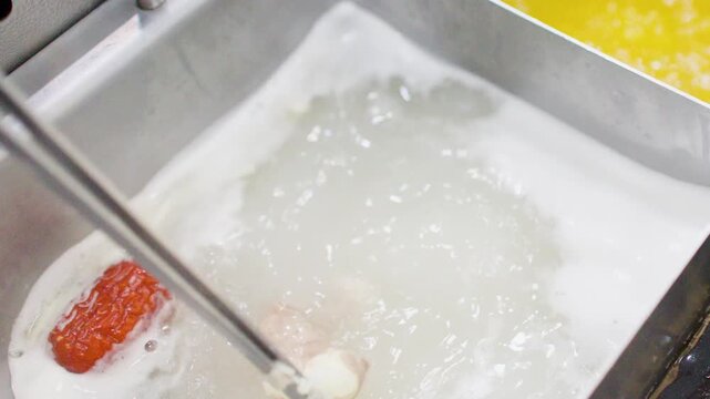 Cooking Thin Pork Slices in Boiling Asian Hot Pot Soup