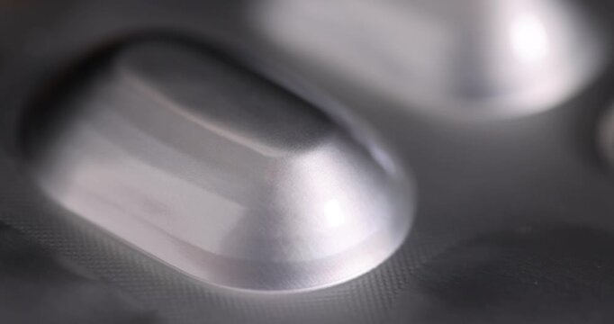 Aluminum blister for medicines, this blister consists of several concave sections and has a characteristic metallic luster of the material.