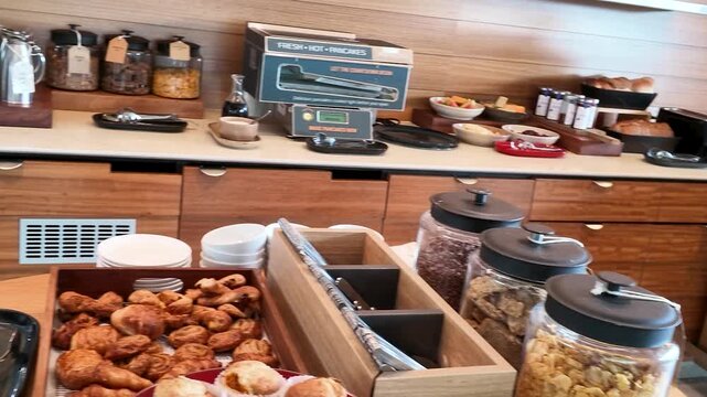 Continental Breakfast Buffet with Pastries and Coffee Station in Paris Hotel