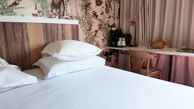 Boutique Hotel Bedroom Interior with Monkey Wallpaper and White Linens