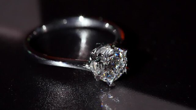 Brilliant Diamond Gold Ring Shines in Dramatic Macro Close-Up. Revealing Its Sparkling Facets Refined Metalwork. Luxurious Blend of Artistry, Elegance and Timeless Beauty In Every Glowing Detail 4k