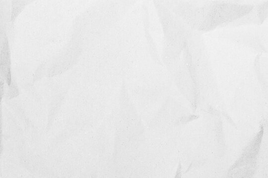 White recycled craft paper texture as background. Grey paper texture, Old vintage page or grunge vignette of old newspaper. Pattern rough art creased grunge letter. Hardboard with copy space for text.