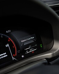 Obraz premium Close Up View of Car Dashboard Instrument Cluster at Night.