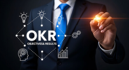 Naklejka premium Businessman drawing OKR diagram for business objectives and results strategy