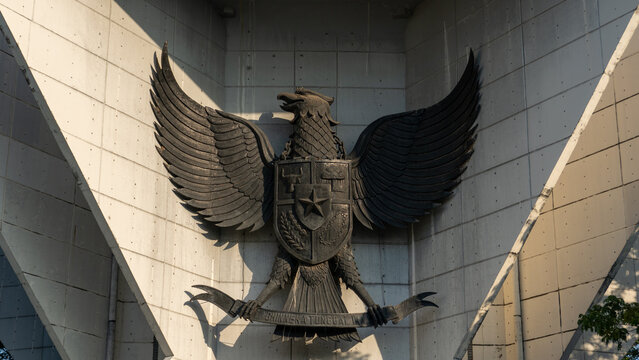 Garuda Pancasila emblem on geometric concrete wall