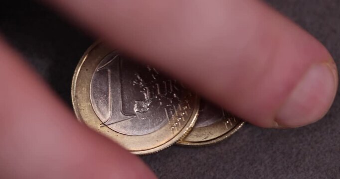   coin of the European Union with a face value of one euro, metal money worth one euro made of combined metals, closeup