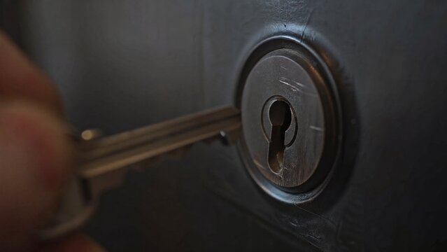 misaligned. A metal key slightly misaligned with a door lock's keyhole in dim light. product launch decks, UI/UX mockups, designed for data visualization dashboards and holographic UIs.