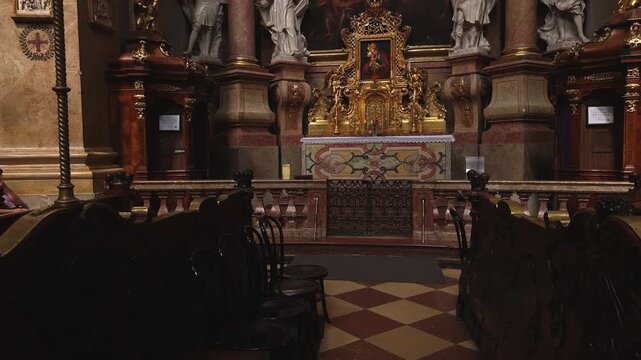 VIENNA, AUSTRIA - 03.05.2026: Beautiful high altar of the Peterskirche. This Baroque Roman Catholic parish church features ornate golden decorations and historical religious architecture.