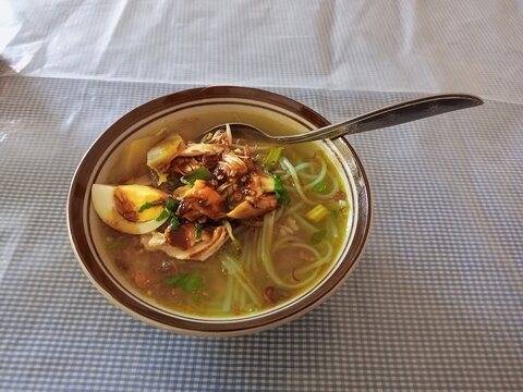 Traditional Indonesian chicken soto soup with egg