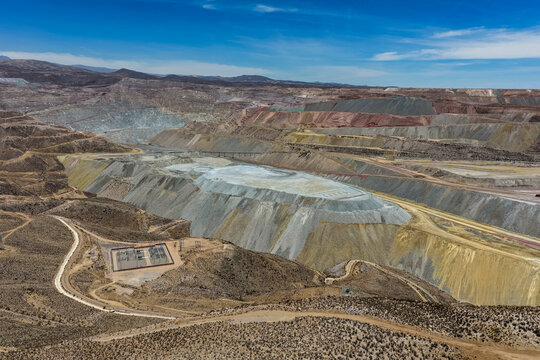 Aerial view of huge mine waste dumps forming platforms