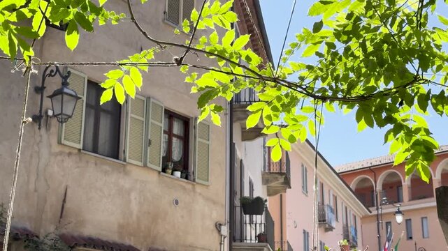 Historic European Village Architecture with Green Leaves in Piedmont Italy