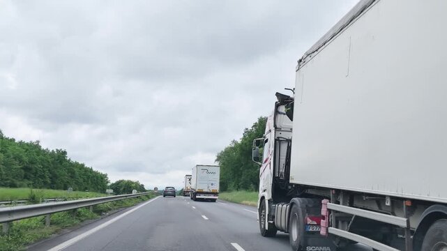 White Semi Truck Driving on a Highway in Paris France