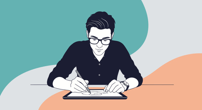 Young man with glasses drawing on tablet, creative desktop illustration