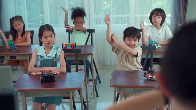 Happy school children participating in interactive STEM lesson