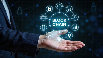 Fototapeta premium Businessman holding blockchain technology concept with digital network icons, security lock, cloud computing and data analysis in futuristic interface background.