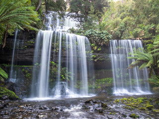 Obraz premium Russell Falls, a tiered–cascade waterfall in the Central Highlands region of Tasmania, Australia.