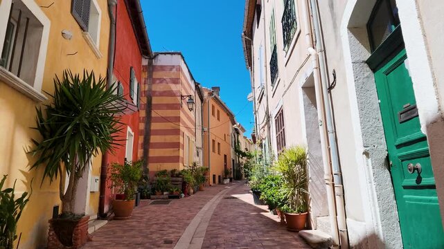 Narrow Colorful Street with Potted Plants in Cassis France