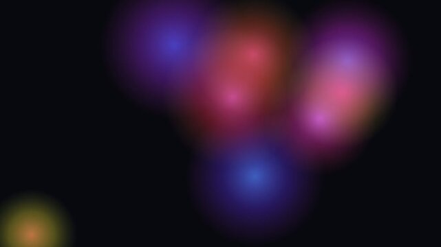 Abstract background featuring soft glowing orbs of vibrant red blue and purple