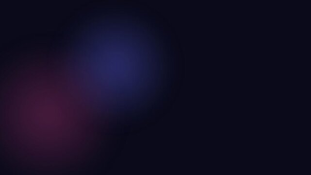 A soft indigo light glow emerging from the darkness of a deep black space