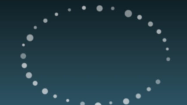 A series of glowing white dots arranged in a perfect oval on a dark background