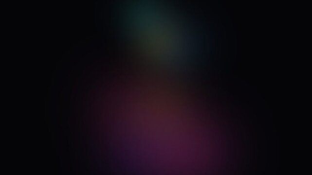 Abstract dark background with soft glowing patches of blue and purple light