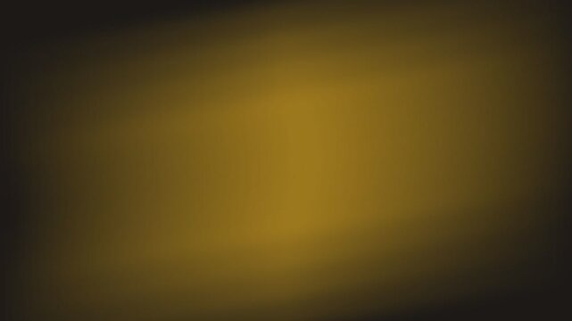 Abstract background featuring a soft gradient of warm golden amber light
