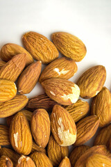 Fototapeta premium Raw almonds filling the frame in a detailed close up composition. Healthy natural snack ingredient with visible nut texture