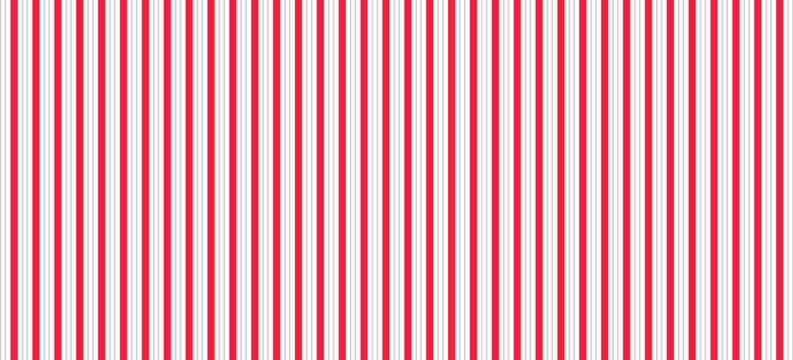 Red and pink Christmas seamless pattern. Candy cane diagonal stripes background. Repeating decoration wallpaper. Winter holidays lines backdrop. Xmas peppermint present wrapping print design. Vector