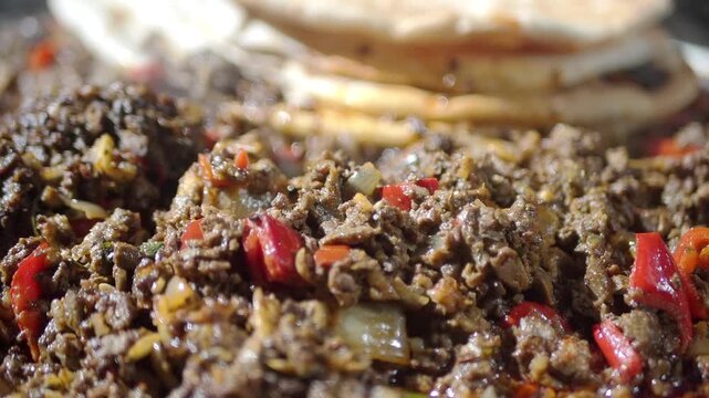 Making meat stew with flatbread in local kitchen