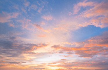 Fototapeta premium Soft pastel clouds glow with sunset's warmth